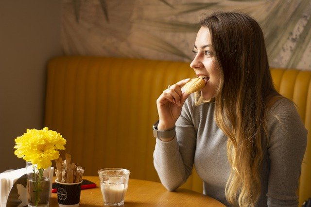 lady eating a pastry